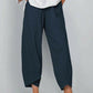 Pantalon vintage à taille élastique et poches asymétriques